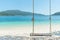 Swing hang from coconut palm tree over beach sea in Phuket ,Thailand.