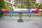 Swing on a metal spiral.Double seats rocking spring . New modern plastic bright colorful blue and red empty toy seesaw swing on