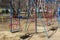 Swing on the playground fenced with a red-white forbidding tape