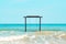 swing in the sea with an empty inscription Board. Exotic Tropical Paradise Swings over Crystal Clear Turquoise Blue Ocean Sea