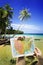 Swing under coconut tree and sea