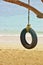 Swing wheel tire with rope on amazing shore