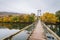 Swinging bridge over the James River and fall color in Buchanan, Virginia