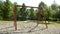 Swinging empty children\'s swing in the playground. Sunny spring morning