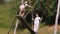 swinging. Happy woman, grandmother, with a teenage girl, granddaughter, are having fun swinging together on a big wooden