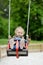 Swinging preschooler having fun