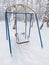 Swings covered with snow