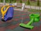 Swings on the playground. Beautiful, multi-colored children\\\'s swing on the playground in the city park. Close-up