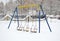 Swings with snow