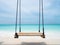 Swings on Tropical Maldivian Island with Turquoise Blue Ocean Sea Water