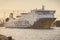 Swinoujscie, West Pomeranian - Poland - July 15, 2022: Cracovia ferry entering to port in Swinoujscie at sunrise. Transport
