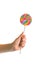 Swirl colorful lollipop in child hand