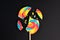 Swirl round broken lollipop on black background.