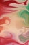 Swirled marbled background in red green orange pink and beige colors, elegant dramatic motion or wind movement design