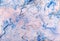 Swirling blue and white marbled paper