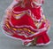 Swirling red Mexican dance dress on street