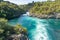 Swirling and surging river water through rocky ravine