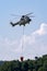 Swiss Air Force Aerospatiale AS332 TH89 military utility helicopter T-320 flying with bambi buckets for aerial fire fighting