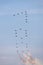 Swiss Air Force Northrop F-5 jets flying in a special formation of 24 aircraft spelling out â€˜100â€™ in the sky