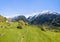 Swiss alps meadow at the beautiful village Soglio with the mountain range Sciora