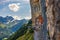 Swiss Alps and a restaurant under a cliff on mountain Ebenalp in Switzerland