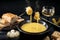 Swiss cheese fondue with bread, pickles and wine, the festive dinner is often served at new year, dark rustic background, copy