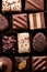 Swiss chocolates in gift box, various luxury pralines made of dark and milk organic chocolate in chocolaterie in