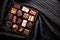 Swiss chocolates in gift box, various luxury pralines made of dark and milk organic chocolate in chocolaterie in