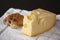 Swiss Emmental cheese and a home baked bun on white cloth background