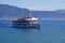 a Swiss excursion ship on scenic lake Constance (Bodensee) with Alps in background on sunny day in spring