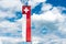 Swiss flag banner under an expressive blue sky with white cumulus clouds and copy space