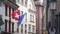 The Swiss Flag hangs from a storefront on a rather typical Swiss Street