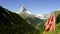 Swiss flag on mountain top