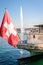 A Swiss flag at the stern of the steamer `Savoie` in Geneva, Switzerland