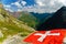 Swiss flag with Val Ferret valley in Switzerland
