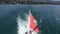 Swiss flag waving on the back of speed boat leaving Lausanne port on Lake Leman Geneva Lake, Switzerland