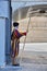 Swiss Guard guards the Gate of St. Peter`s Basilica in Vatican State City