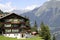 Swiss house and mountains on background