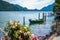 Swiss landscape of luxury speedboat moored at the shore of Lake Lugano in Morcote, Switzerland.