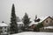 Swiss village Urdorf in winter under snow. Rooftops of the houses are covered with layer of snow.