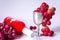 Swiss wine bottle, grapes and a silver cup