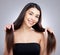 Switch to hydrating haircare products and see the change. Studio portrait of an attractive young woman posing against a