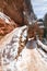 Switchbacks in snow on Angels Landing Hiking Trail during winter in Zion National Park in Utah