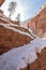 Switchbacks in snow on Angels Landing Hiking Trail during winter in Zion National Park in Utah