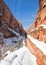 Switchbacks in snow on Angels Landing Hiking Trail during winter in Zion National Park in Utah