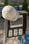 A switchboard on a construction site with sockets and an old work helmet hanging from it. Providing electricity to the