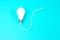 A Switched on light bulb on a light blue background - a symbol of a new idea, innovation