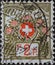 Switzerland - Circa 1911: a postage stamp printed in the Switzerland showing the Swiss coat of arms framed with flowers and high m