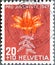 Switzerland - Circa 1947 : a postage stamp printed in the swiss showing a fire lily plant Lilium bulbiferum Liliaceae