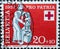Switzerland - Circa 1957 : a postage stamp printed in the swiss showing a needy and helper. Red cross coat of arms. Federal celebr